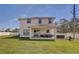 Large backyard with a patio, hot tub, and green lawn at 2190 Fairway S Ave, St Petersburg, FL 33712