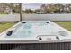 Hot tub with bubbling water situated in a grassy backyard at 2190 Fairway S Ave, St Petersburg, FL 33712