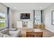 Cozy living room with a plush sofa, modern TV setup, and ample natural light at 2190 Fairway S Ave, St Petersburg, FL 33712