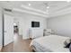 Comfortable main bedroom with hardwood floors, a TV, and a glimpse into the attached study at 2190 Fairway S Ave, St Petersburg, FL 33712