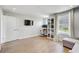 Office space featuring a large window, sleeper sofa, and built in bookshelf at 2190 Fairway S Ave, St Petersburg, FL 33712