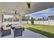 Covered patio with outdoor furniture and a hot tub, overlooking the backyard at 2190 Fairway S Ave, St Petersburg, FL 33712