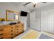 Bedroom with a ceiling fan, dresser, and closet at 233 Cascade Bend Dr, Ruskin, FL 33570