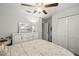 Bright bedroom with a ceiling fan, dresser, and closet at 233 Cascade Bend Dr, Ruskin, FL 33570
