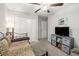 Bedroom with a ceiling fan, daybed, and television at 233 Cascade Bend Dr, Ruskin, FL 33570