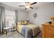 Cozy bedroom featuring a ceiling fan, natural light, and coordinated decor at 233 Cascade Bend Dr, Ruskin, FL 33570