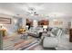 Spacious living room featuring a stylish rug, neutral furniture, and an open layout at 233 Cascade Bend Dr, Ruskin, FL 33570