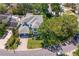 Stunning aerial shot showcases the estate home, lush trees, manicured lawns, and paved circular driveway at 2501 S Dundee St, Tampa, FL 33629