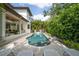 View of the home's backyard pool and patio area with outdoor seating at 2501 S Dundee St, Tampa, FL 33629