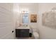 Bathroom featuring modern vanity with marble countertop, mirror and floral art at 2501 S Dundee St, Tampa, FL 33629