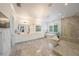 Spa-like bathroom featuring a soaking tub, a glass-enclosed shower, and double vanity at 2501 S Dundee St, Tampa, FL 33629