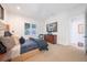 Inviting bedroom showcases a comfortable bed with stylish bedding, a carpeted floor, and bright natural light at 2501 S Dundee St, Tampa, FL 33629