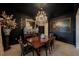 Sophisticated dining room with dark walls, crystal chandelier, and elegant decor at 2501 S Dundee St, Tampa, FL 33629