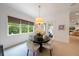 Dining room with round table, natural light, and view of greenery at 2501 S Dundee St, Tampa, FL 33629