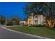 Beautiful two-story home with a well-manicured lawn, two-car garage and a basketball hoop on the driveway at 2501 S Dundee St, Tampa, FL 33629