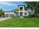 Stunning two-story home with a manicured lawn, two-car garage and landscaping with curb appeal at 2501 S Dundee St, Tampa, FL 33629