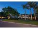 Charming home with lush landscaping, mature trees, and a well-manicured lawn create curb appeal at 2501 S Dundee St, Tampa, FL 33629