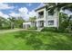 Attractive two-story home featuring a lush front lawn, a two-car garage, and a basketball hoop at 2501 S Dundee St, Tampa, FL 33629
