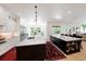 Open kitchen featuring double islands with white countertops and dark wood cabinetry at 2501 S Dundee St, Tampa, FL 33629