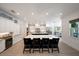 Modern kitchen featuring a large island with seating, custom cabinets and marble countertops at 2501 S Dundee St, Tampa, FL 33629