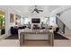 Well-lit living room featuring modern furniture, a decorative console table, and staircase at 2501 S Dundee St, Tampa, FL 33629