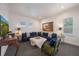 Inviting living room features a comfortable sofa, golf-course-themed TV show, and stylish decor at 2501 S Dundee St, Tampa, FL 33629