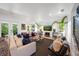 Bright living room with stylish decor, comfortable seating, and a modern brick wall at 2501 S Dundee St, Tampa, FL 33629