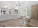 The main bathroom features double sinks, a soaking tub, tiled shower, and marble floors at 2501 S Dundee St, Tampa, FL 33629