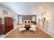 Well-lit main bedroom with accent wall, decorative furniture, and stylish decor at 2501 S Dundee St, Tampa, FL 33629