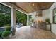 View of the poolside patio and outdoor kitchen with stainless steel grill at 2501 S Dundee St, Tampa, FL 33629