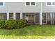 Backyard view of the screened lanai from the home and lush green grass at 2525 Arbor Wind Dr, Lutz, FL 33558
