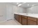 Bathroom with double vanity, spacious counter, and large mirror at 2525 Arbor Wind Dr, Lutz, FL 33558