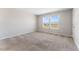 Bright bedroom with large windows and plush carpeting at 2525 Arbor Wind Dr, Lutz, FL 33558