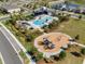 An aerial shot showing the community pool, playground, common areas, and Gathering-friendly amenities at 2525 Arbor Wind Dr, Lutz, FL 33558