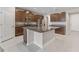 Spacious kitchen featuring stainless steel appliances, granite countertops, and a large island at 2525 Arbor Wind Dr, Lutz, FL 33558