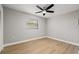 Bedroom with wood-look flooring and ceiling fan at 2719 Cypress Hollow Ct, New Port Richey, FL 34655