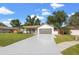 Charming single-Gathering home with a well-maintained lawn, a two-car garage and a long driveway at 2719 Cypress Hollow Ct, New Port Richey, FL 34655