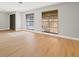 Open living space featuring wood-look floors, natural light and a neutral palette at 2719 Cypress Hollow Ct, New Port Richey, FL 34655