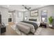 Serene main bedroom featuring a neutral color palette, elegant furnishings, and ample natural light at 2719 Cypress Hollow Ct, New Port Richey, FL 34655