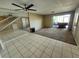 Spacious living room featuring tile floors and a staircase leading to the second floor at 2751 S Pines Dr # 10, Largo, FL 33771
