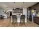 Well-appointed kitchen featuring an island with barstool seating, stainless steel appliances, and a pantry at 29002 Trevi Pl, Wesley Chapel, FL 33543