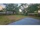 Large backyard with mature trees and partial fencing at 3009 S Willow Dr, Plant City, FL 33566