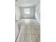 Clean, bright bedroom with tile flooring, a closet and fresh paint at 3009 S Willow Dr, Plant City, FL 33566