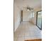 Bonus room featuring tile flooring and slider door to back yard at 3009 S Willow Dr, Plant City, FL 33566