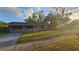 Charming single-story home with a well-maintained front yard and mature trees at 3009 S Willow Dr, Plant City, FL 33566