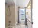 Bathroom with a shower/tub combo and a large mirror, designed for relaxation at 3014 Ashland Ter, Clearwater, FL 33761