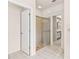 Clean bathroom featuring a glass-enclosed shower and tile flooring at 3014 Ashland Ter, Clearwater, FL 33761