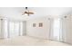 Bright and airy bedroom with neutral carpet, ceiling fan, and sheer curtains at 3014 Ashland Ter, Clearwater, FL 33761