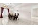 Dining room features tile flooring, a chandelier, and a view of the backyard at 3014 Ashland Ter, Clearwater, FL 33761