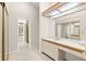 Dressing area with carpet, vanity, and closet with a bathroom located nearby at 3014 Ashland Ter, Clearwater, FL 33761